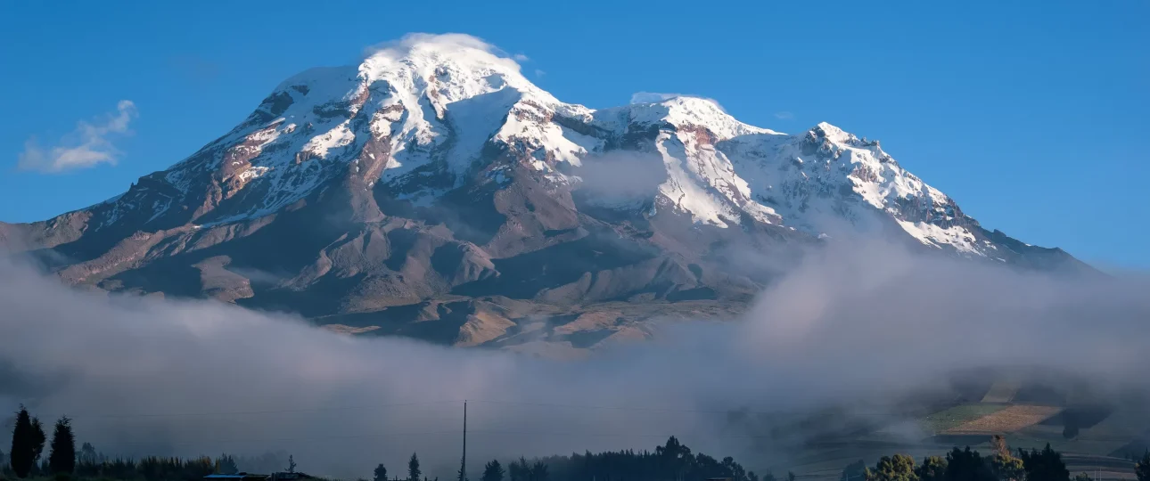 Snow-capped Chimborazo Volcano rising above the Andean highlands in Ecuador.