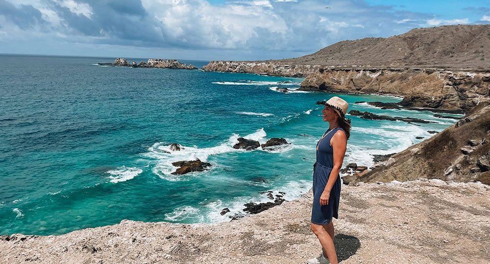 Panoramic view of Los Frailes beach with turquoise waters and coastal cliffs in Ecuador.